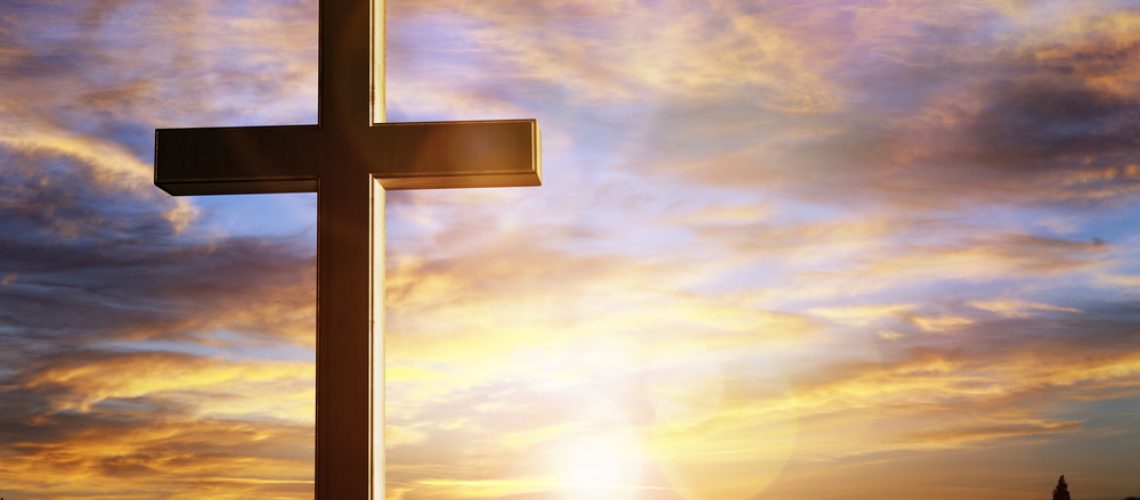 Crucifix cross at sunset background, crucifixion of Jesus Christ